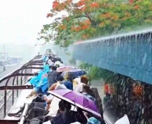 Eid Journey in Bangladesh: Passengers on Train Roof — Joyful but Risky